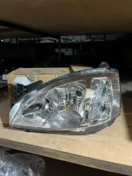 FAROL DIREITO CORSA MONTANA 08/11 CROMADO NOVO