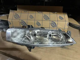 FAROL DIREITO VECTRA 2000 A 2005 CROMADO NOVO