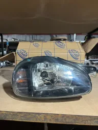 FAROL DIREITO CORSA 2000 A 2010 MASCARA NEGRA L.D. NOVO