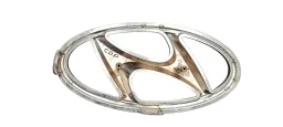 EMBLEMA GRADE PARACHOQUE DIANT. ORIGINAL HYUNDAI HB20 16-19