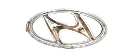 EMBLEMA GRADE PARACHOQUE DIANT. ORIGINAL HYUNDAI HB20 16-19