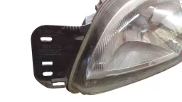 FAROL ESQUERDO FIESTA 2000/2002 COURIER 00/13 PISCA LARANJA