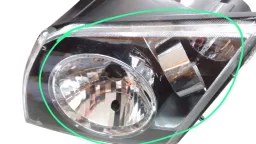 FAROL ESQUERDO ECOSPORT 2003 A 2007 PISCA CRISTAL AVARIA