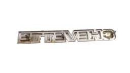 EMBLEMA TAMPA TRASEIRA GM CHEVETTE (FERRO) 1980/1986