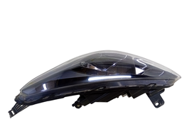 FAROL ESQUERDO KA 2018 A 2021 MASC NEGRA  (DETALHE)