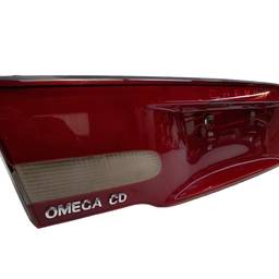 LANTERNA TAMPA ESQUERDA OMEGA 1999 A 2002 (CENTRAL) QUEBRADA