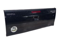 TAMPA TRASEIRA CAÇAMBA HILUX 09 A15 C/ FURO CHAVE C/DETALHE