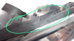 FAROL ESQUERDO CLIO 2004 A 2012 MASC NEGRA (AVARIA)