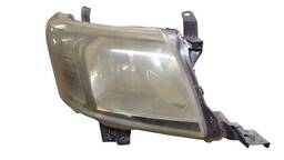 Farol Direito Hilux 2012/2015 máscara negra (lente amarela) 